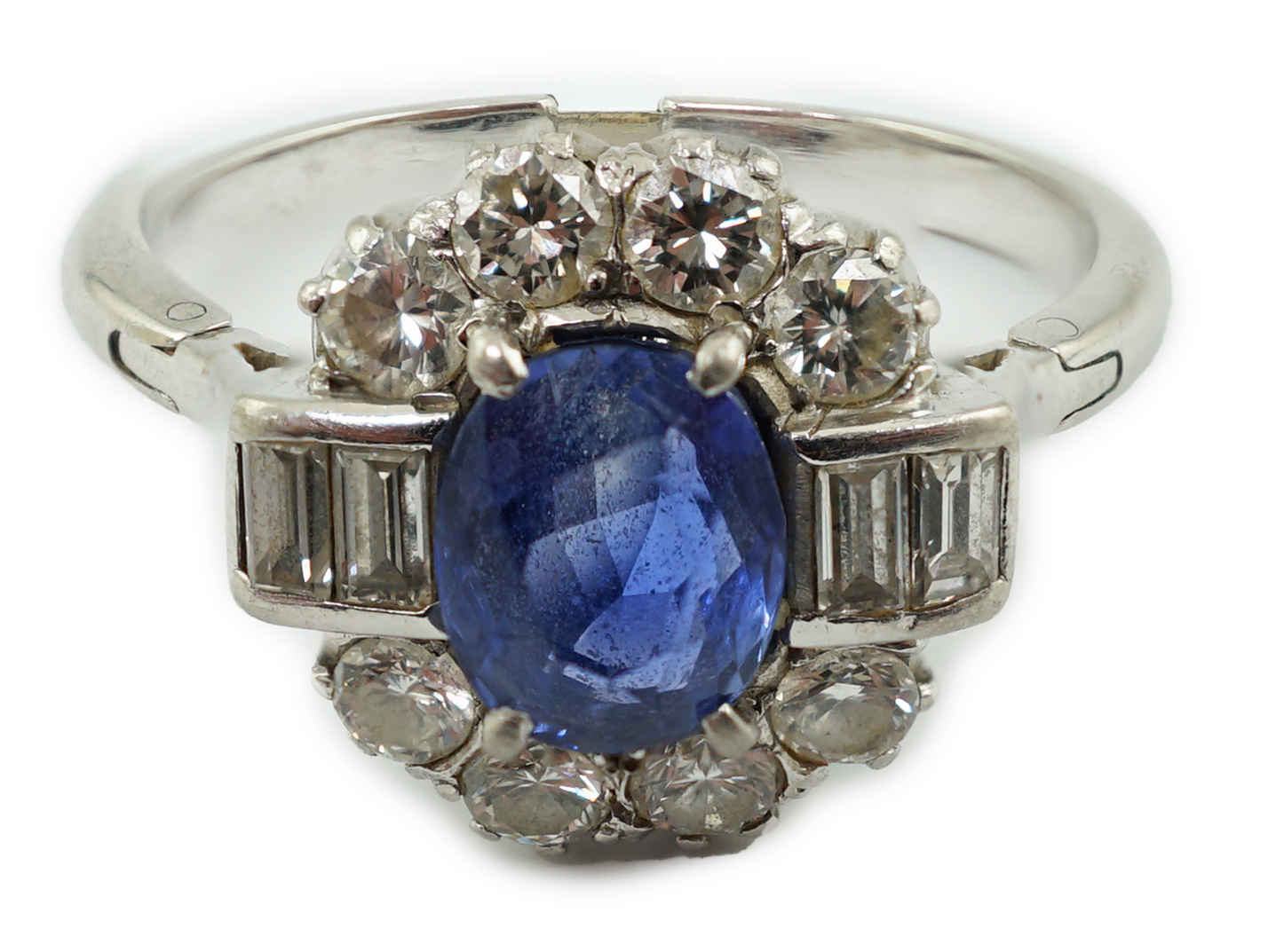 An Art Deco style platinum?, sapphire and diamond cluster ring